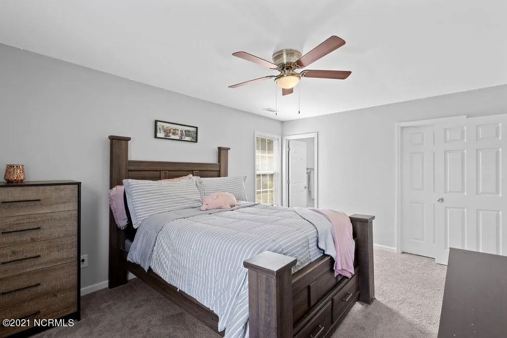 Renovated bedroom of the Raspberry Court home in Hubert, NC